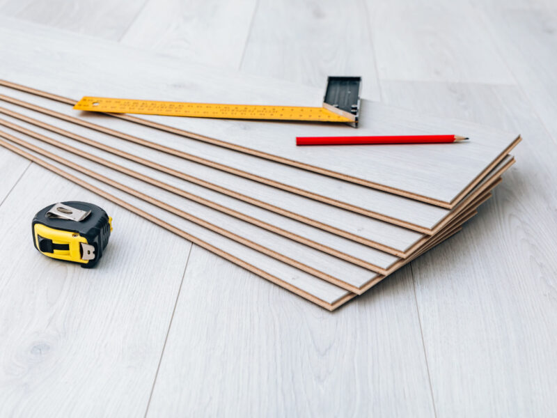 Laminate installing equipment on planks close-up