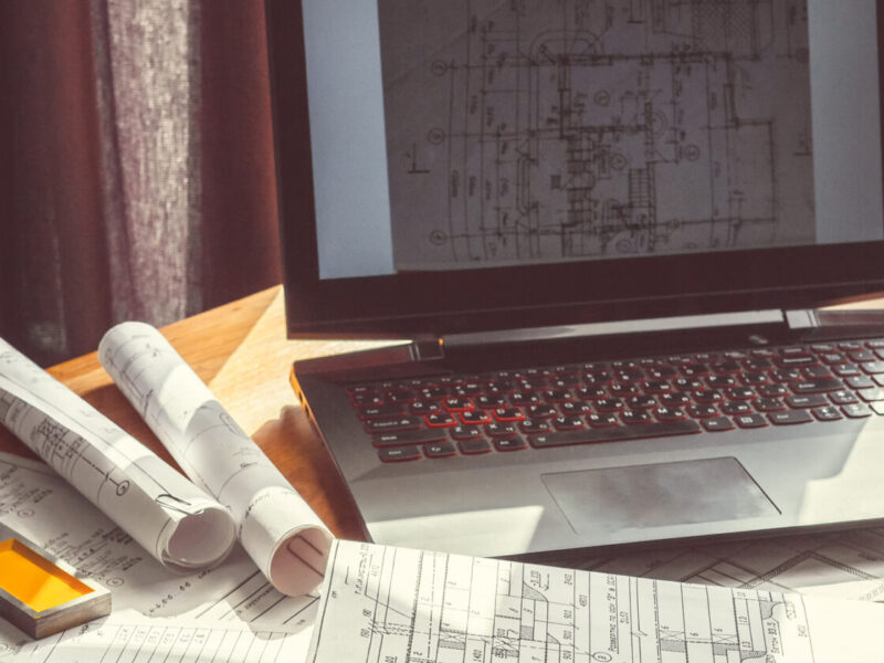 Architect works remotely from home in quarantine, lockdown covid 19 coronavirus. Remote work, stay home, new normality, social distance. Architect design working drawing sketch plans blueprints