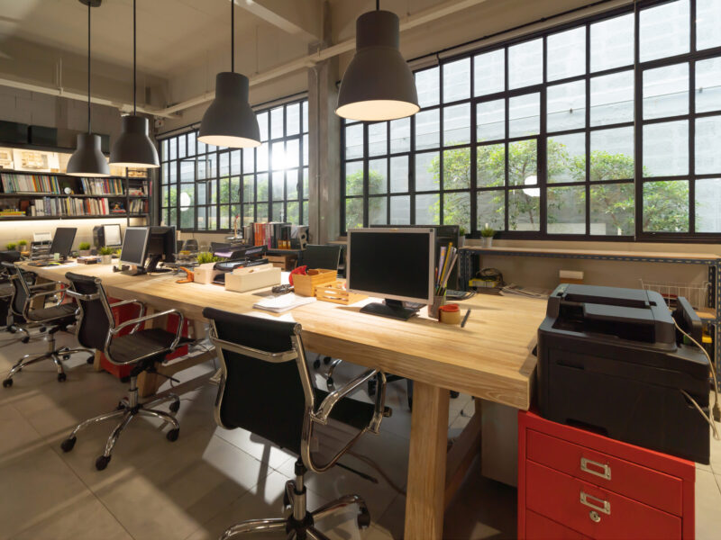 Empty coworking space modern office room. Building facility desk and table. Business community center architecture interior and design area in company.